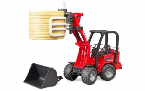 Schaeffer Compact loader 2630 with bale gripper and 1 round bale
